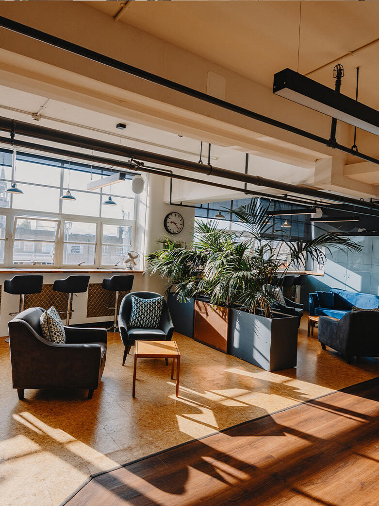 Modern office interior with open workspaces, representing commercial office real estate