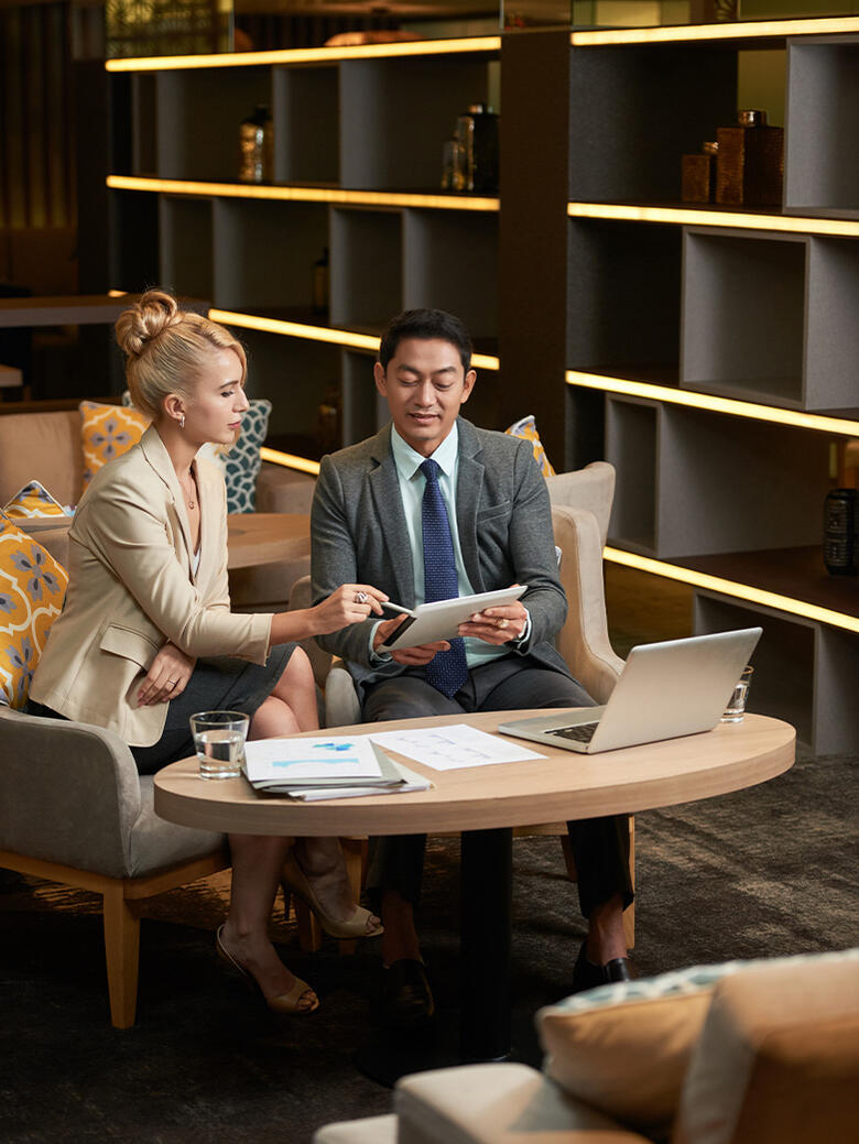 Client and advisor reviewing investment documents together, representing collaborative decision-making
